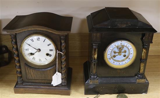 A French slate and enamel mantel clock by S Marti & cie Medaille and a German oak mantel clock